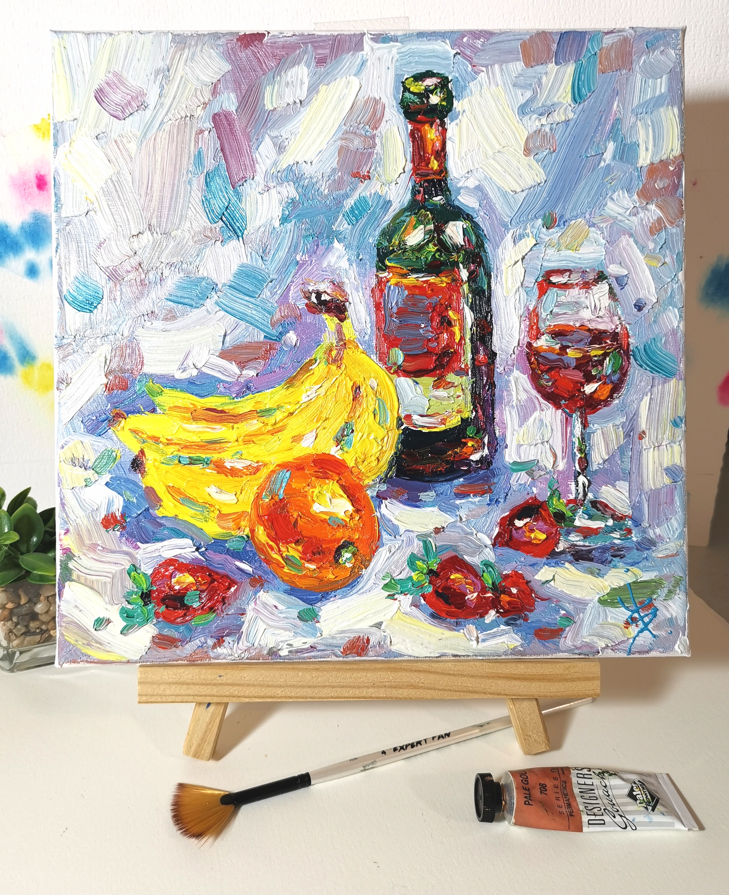 original oil painting still life with wine bottle, glass of red wine, bananas, orange, and strawberries – impasto art on canvas 10x10 inches